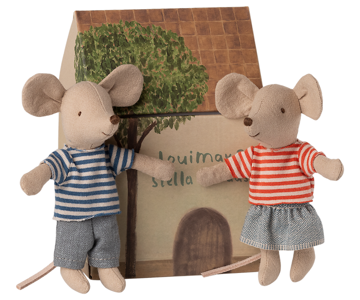 LouiMax and Stella outside their cardboard house.