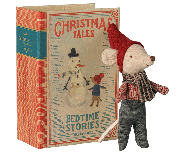 A vintage-style children's book titled 'Christmas Tales: Bedtime Stories' with an illustrated snowman cover, shown next to a mouse wearing a red hat, plaid scarf, and gray pants.