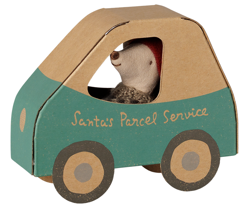Little brother mouse inside the cardboard car with a beige top, blue body, beige wheels with black rims, and 'Santa's Postal Service' on the side.