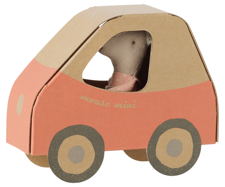 Little sister mouse inside the cardboard car with a beige top and pink body with the words 'muse mini' on the side.