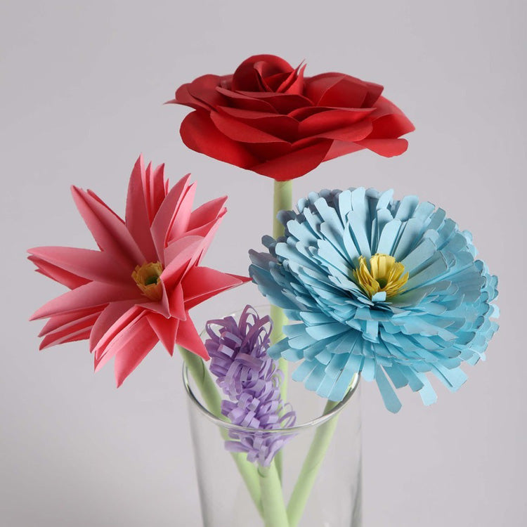 Four paper flowers that were made from the kit.