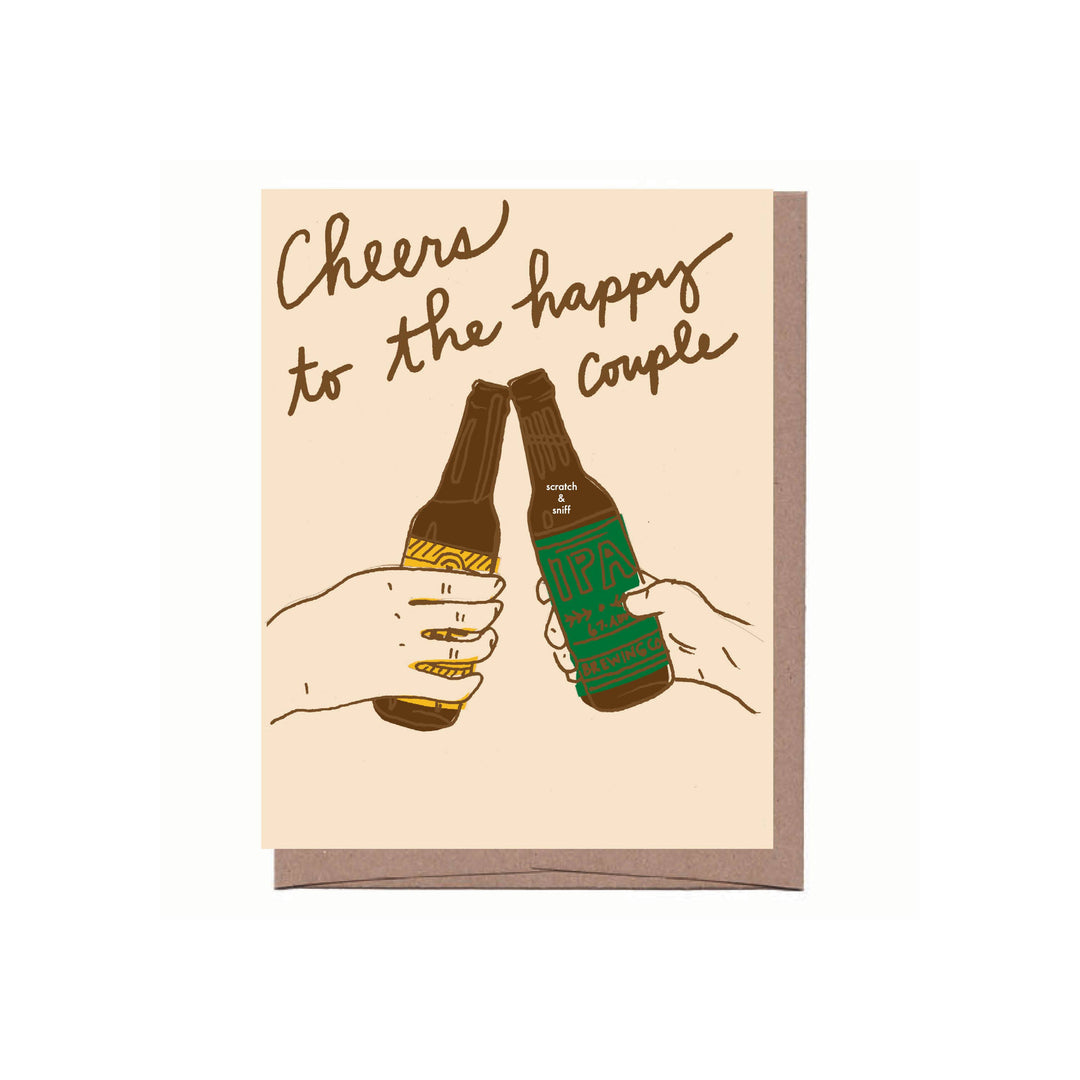 Front of card with drawing of two hands clinking beer bottles under  the text 'Cheers to the happy couple.'