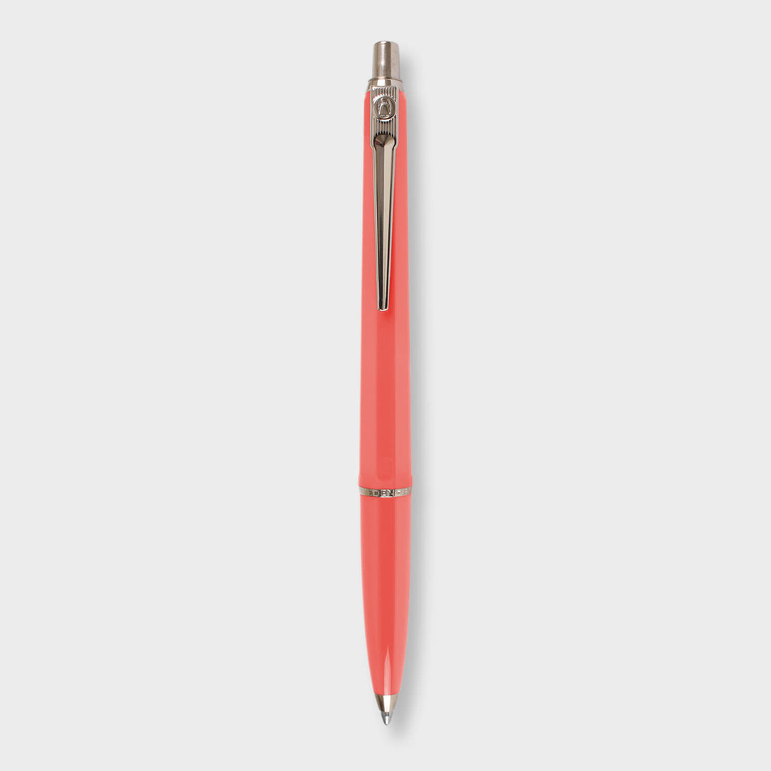 Coral pen with silver clip.