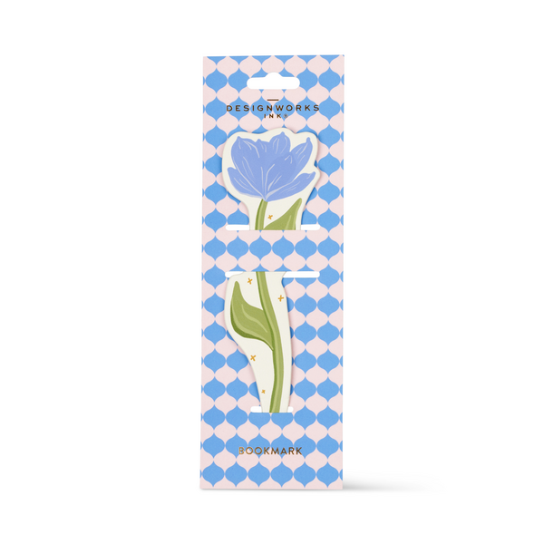 Bookmark in the shape of a blue magnolia, packaged on a blue and white cardboard backing.