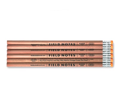 Set of six pencils, with the text 'Field Notes' n black, aligned one atop another. 