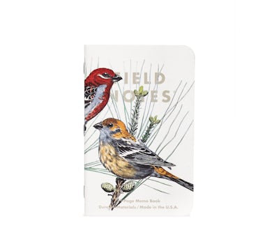 Cover of memo book with two birds on a branch, one with a red head and partially off the page, looking to the right, above one with yellow head and black wings, looking left, and the text 'Field Notes' in gray, all on a white background.