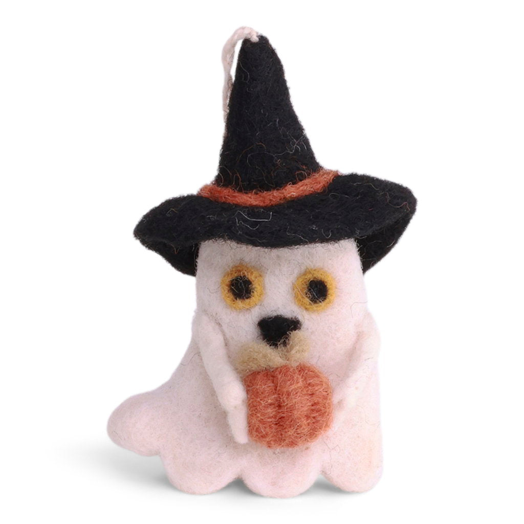 A cute felted wool ghost ornament wearing a black witch hat with a brown band and holding a small orange pumpkin, with black eyes and nose, and a white string for hanging.
