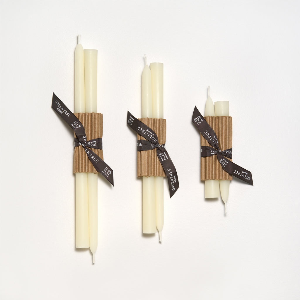 12 inch beeswax taper candle in cream. Shown with two other sizes for comparison.