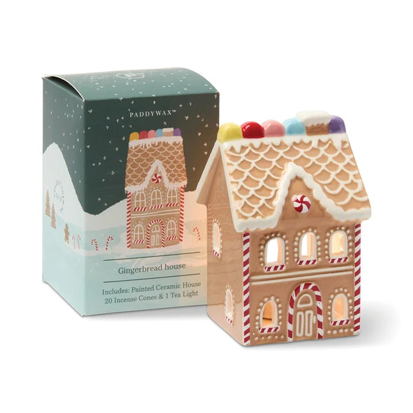 A ceramic gingerbread house with box packaging.