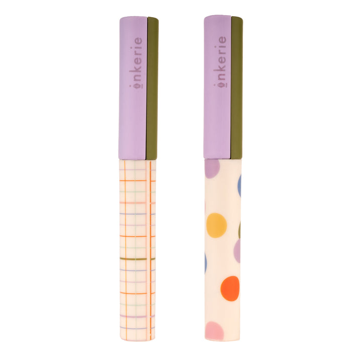 Two scissor cases with colorful designs and 'inkerie' branding on a white background