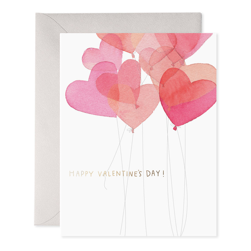 Large heart-shaped balloons in shades of red fill the top of the card front.