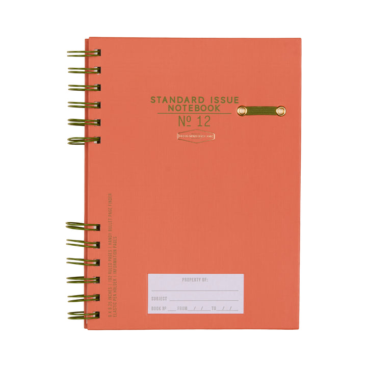 Orange notebook with label for identifying contents and a gold spiral binding.