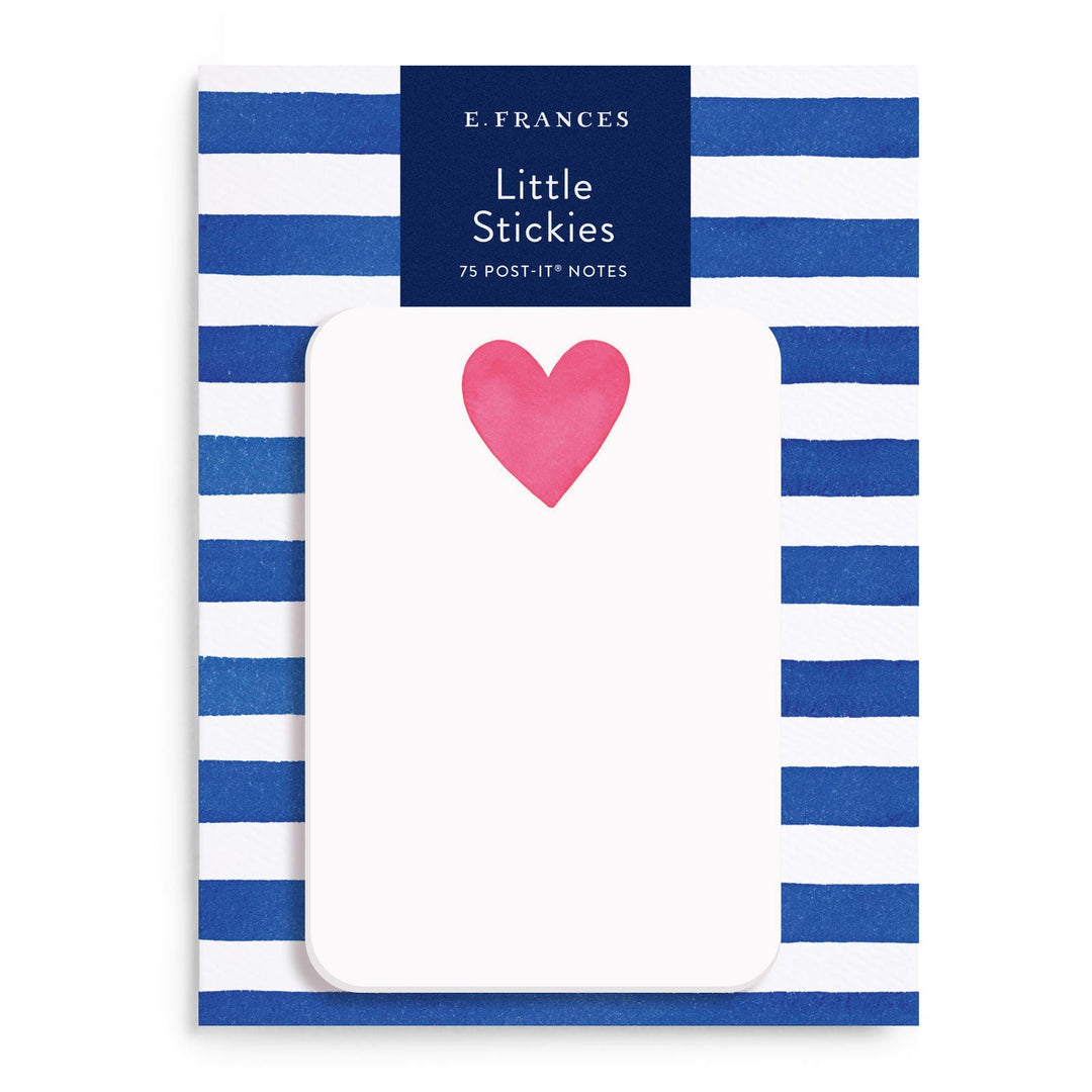 White post-it notes with a red heart at center top, on a blue and white striped package.
