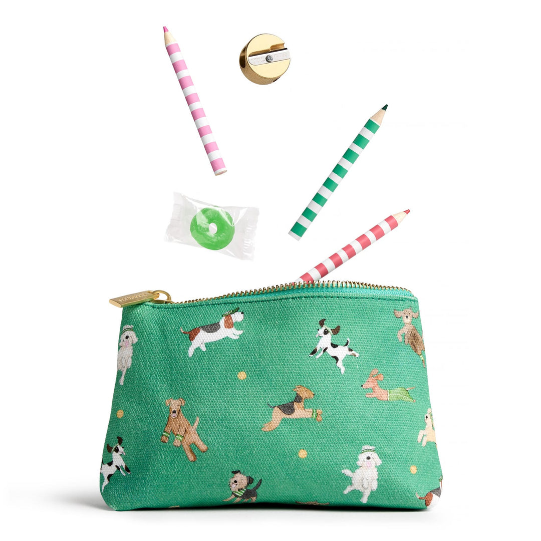 Open green pouch with images of leaping dogs and striped pencils dropping into it.