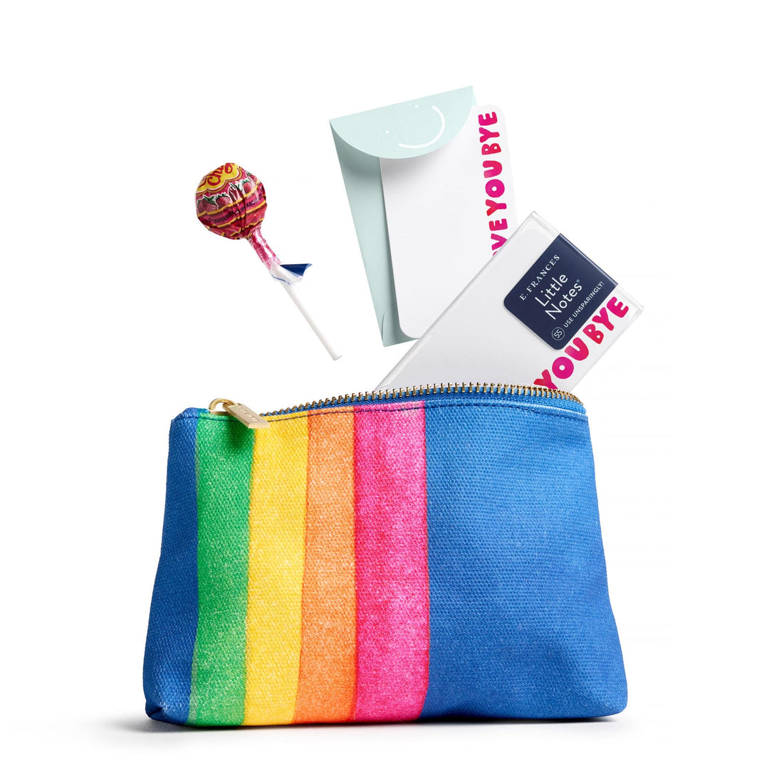 Open pouch with a sucker and a pack of Little Notes dropping into it.