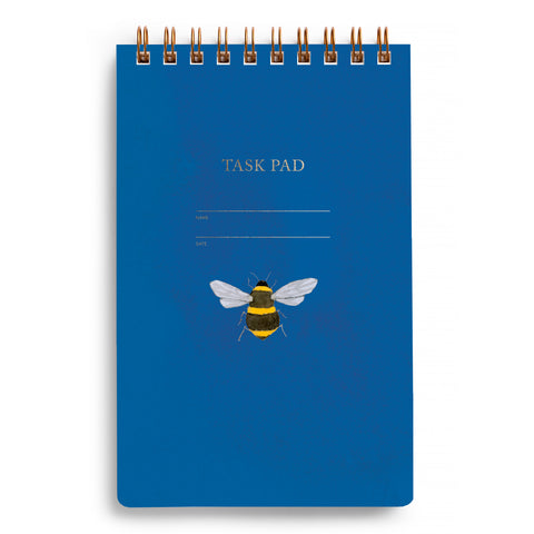 Cover of blue task pad with an illustration of a bee in the center and wire-o binding at the top.