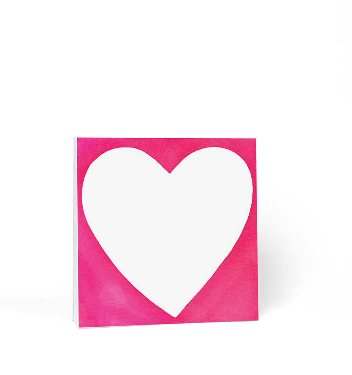 Square pad with large white heart on a red background.
