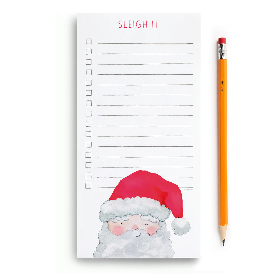 Lined notepad with checkboxes and a winking Santa at the bottom. A pencil is shown to show the size of the notepad.