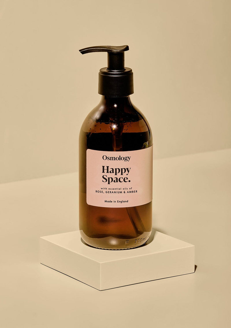 Hand wash in brown glass bottle with pump and light orange label.