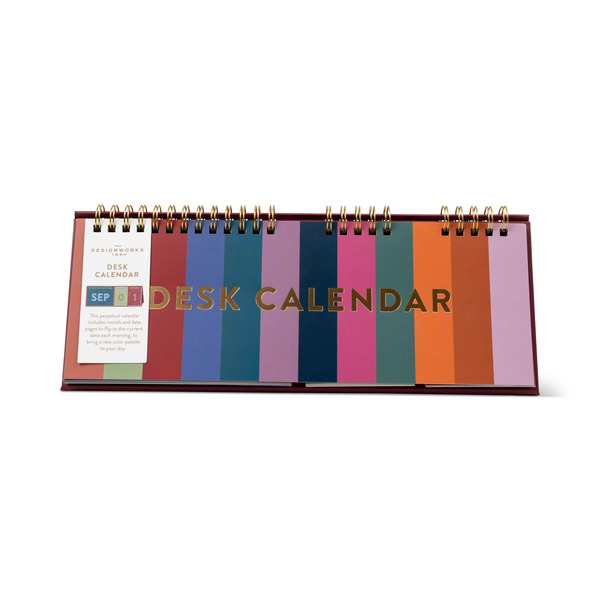 Collapsed calendar showing 12 colored panels that are flipped to reveal the month and date.