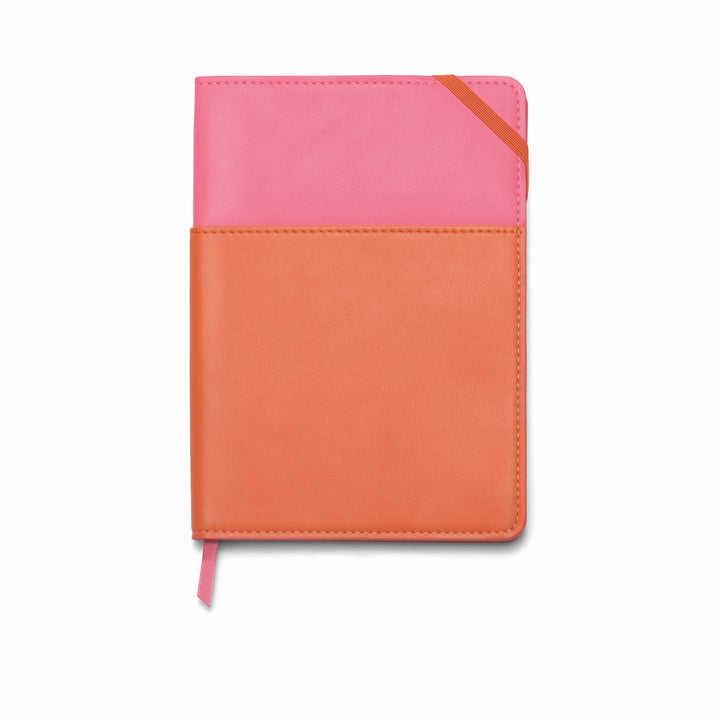Two-tone pink and orange notebook; pink on top and orange underneath with an orange elastic band in the upper right corner.