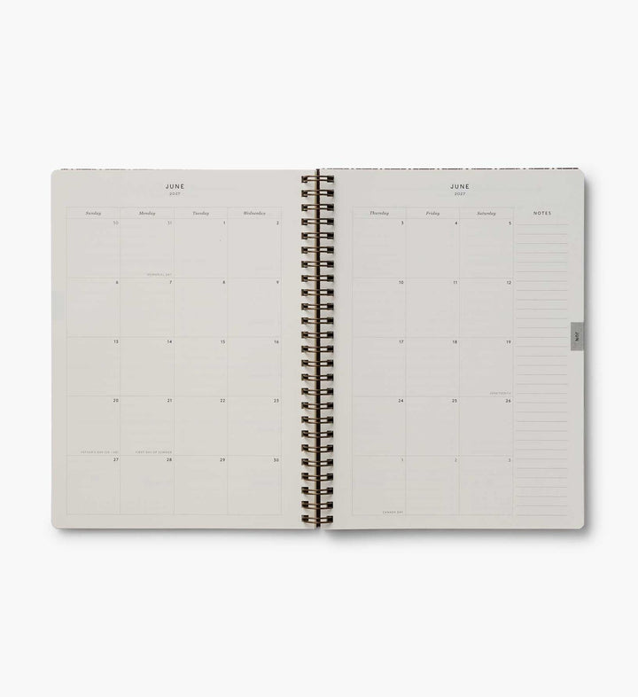 Lay-flat, two-page spread of a month, with space for notes at the right edge.