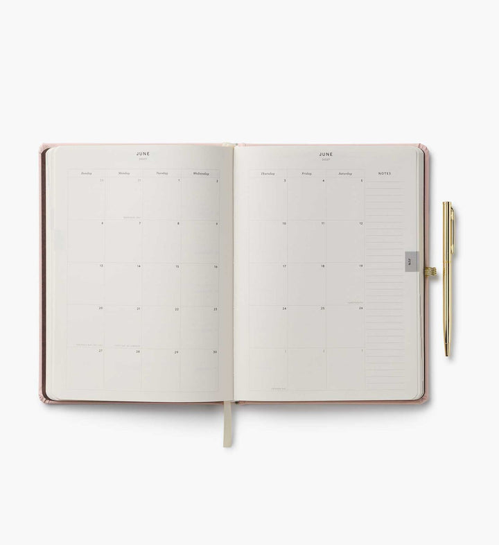 Two-page spread of planner for the month of June, with a notes column at the right side.