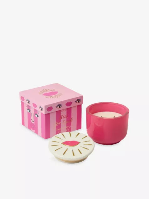 Scented candle in pink container with decorative lid and matching decorated pink box.