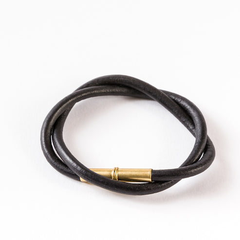 Black double-wrapped smooth leather bracelet with a brass clasp.