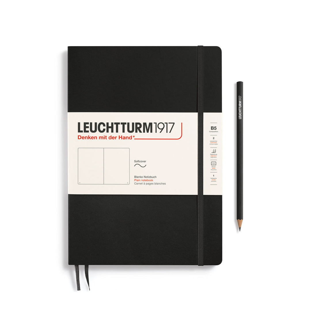 Leuchtturm1917 soft cover plain page notebook in black with white label and elastic closure, next to a black Leuchtturm1917 pencil.