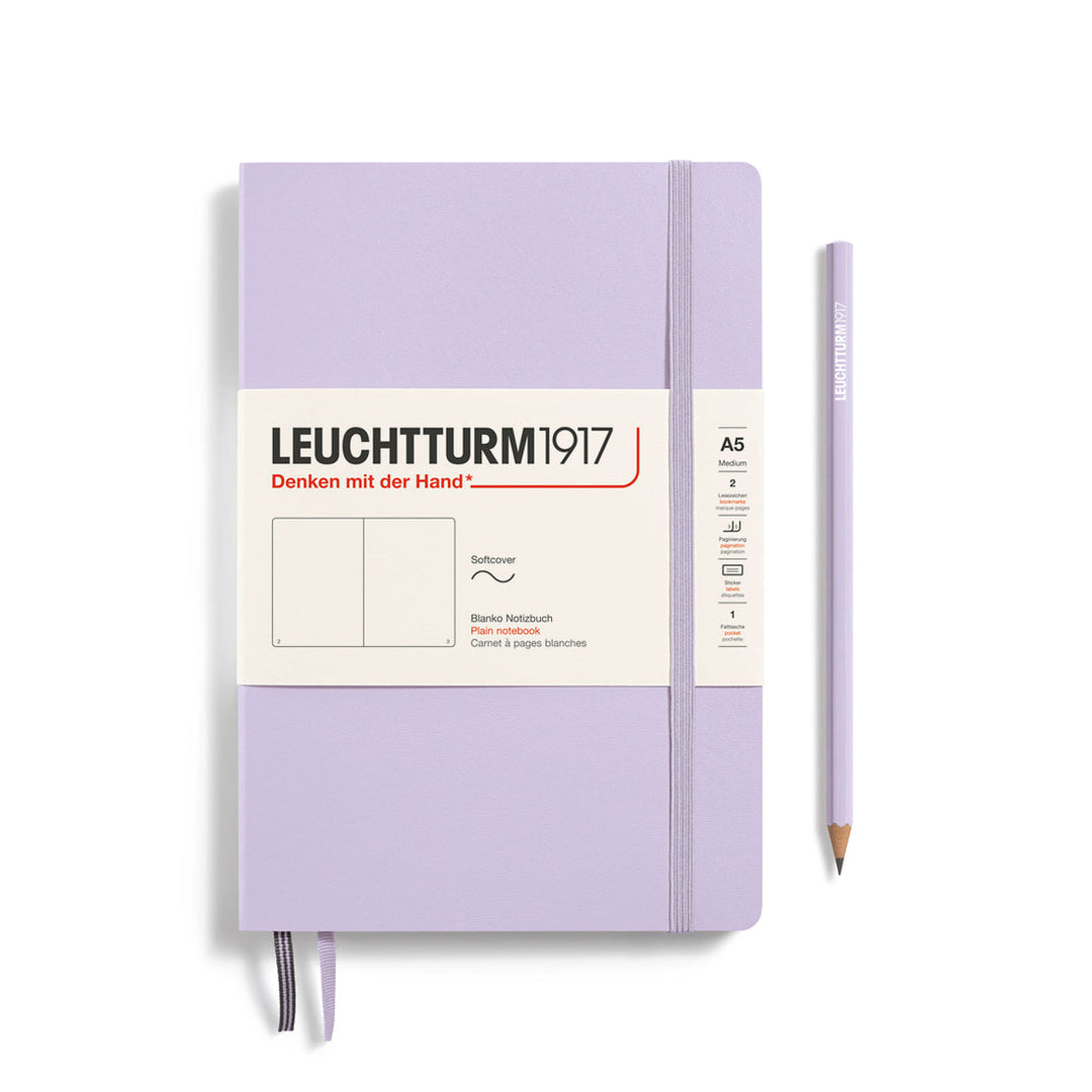 Leuchtturm1917 soft cover plain page notebook in lilac with white label and elastic closure, next to a lilac Leuchtturm1917 pencil.