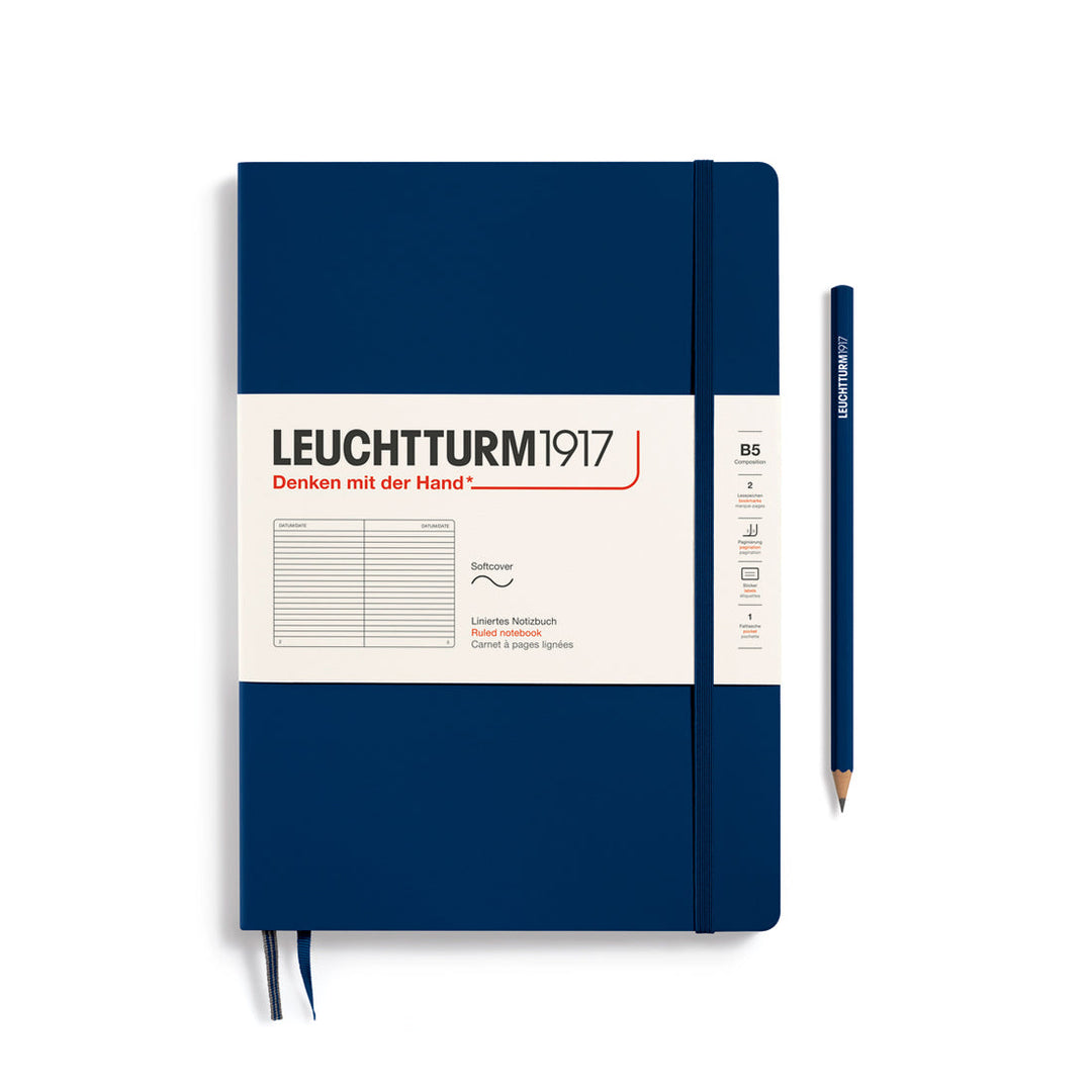 Leuchtturm1917 soft cover ruled page notebook in navy blue with white label and elastic closure, next to a navy blue Leuchtturm1917 pencil.