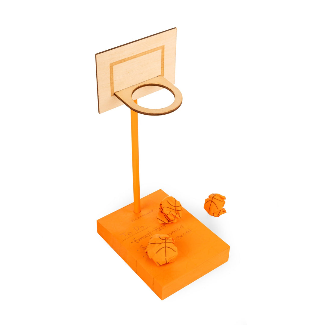 Assembled basketball hoop with crumpled sticky notes.