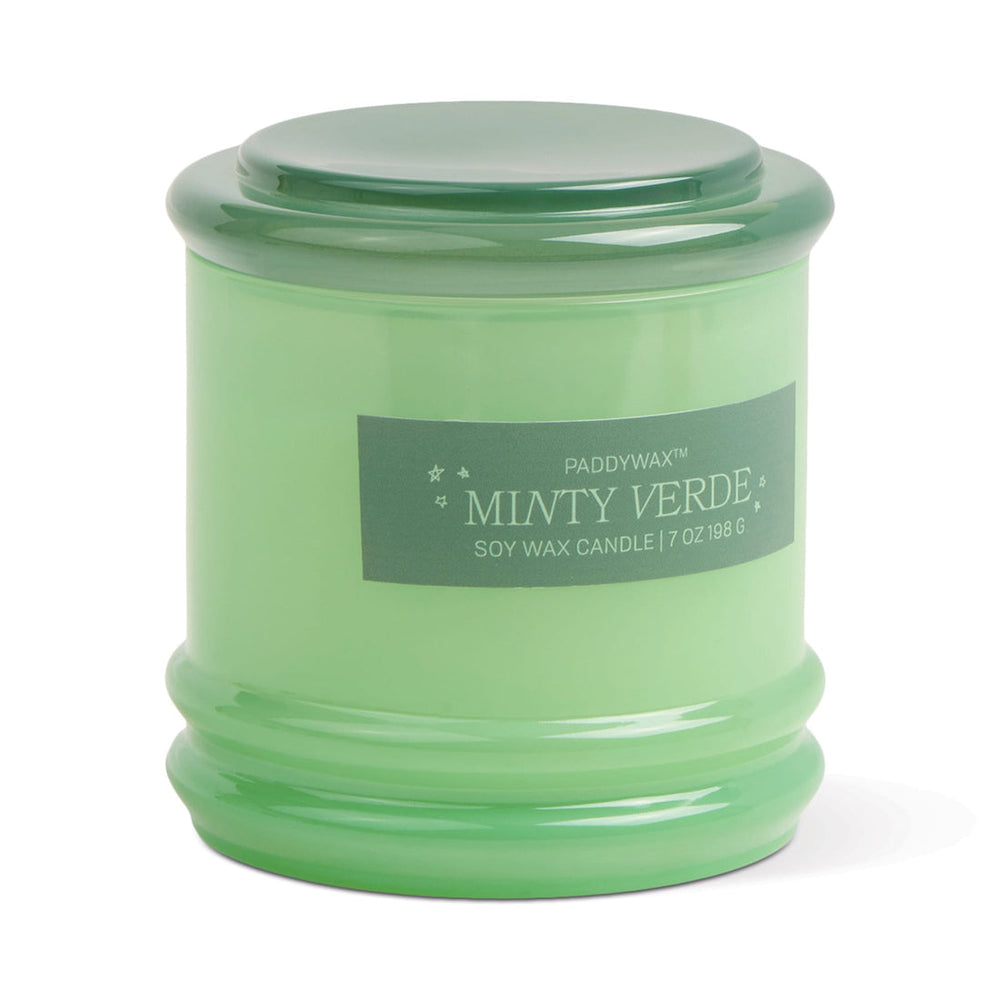 Glass container for candle with light green body and dark green lid.