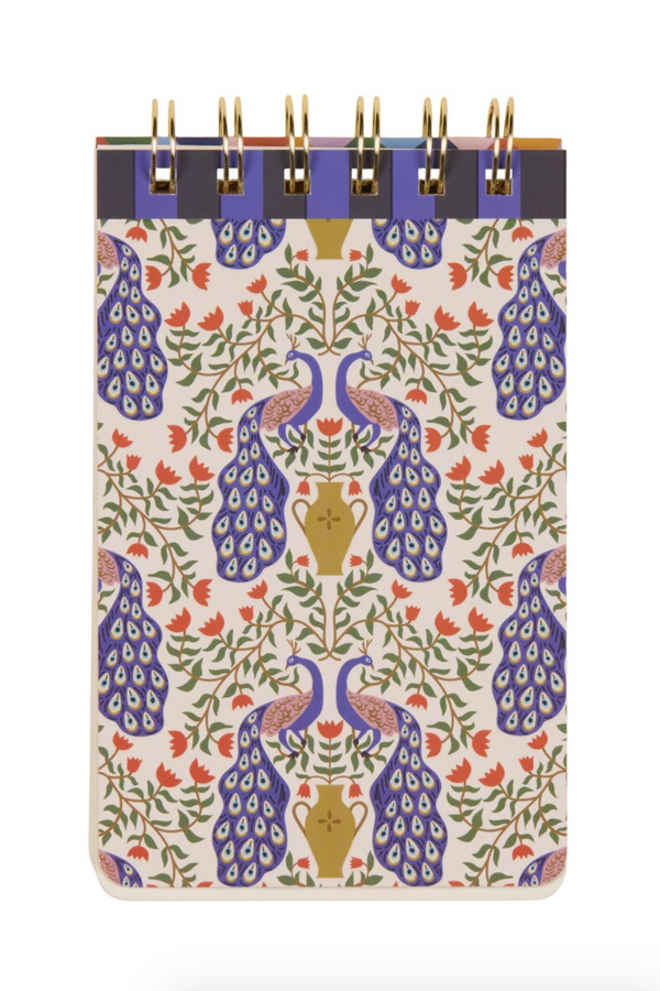 A pattern of purple peacocks surrounded by green vine with orange flowers.