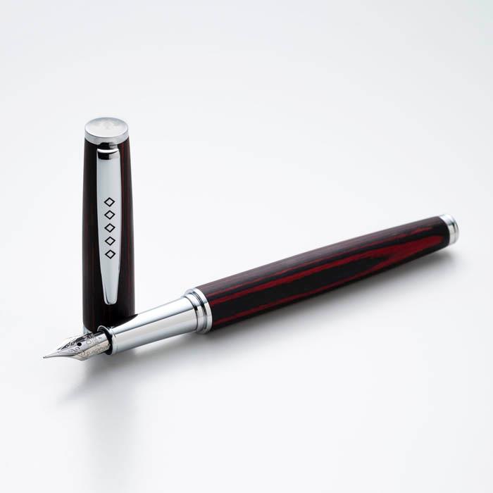 Pen next to its cap.