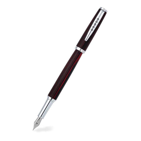 Red hued wood barrel fountain pen with silver nib and clip.