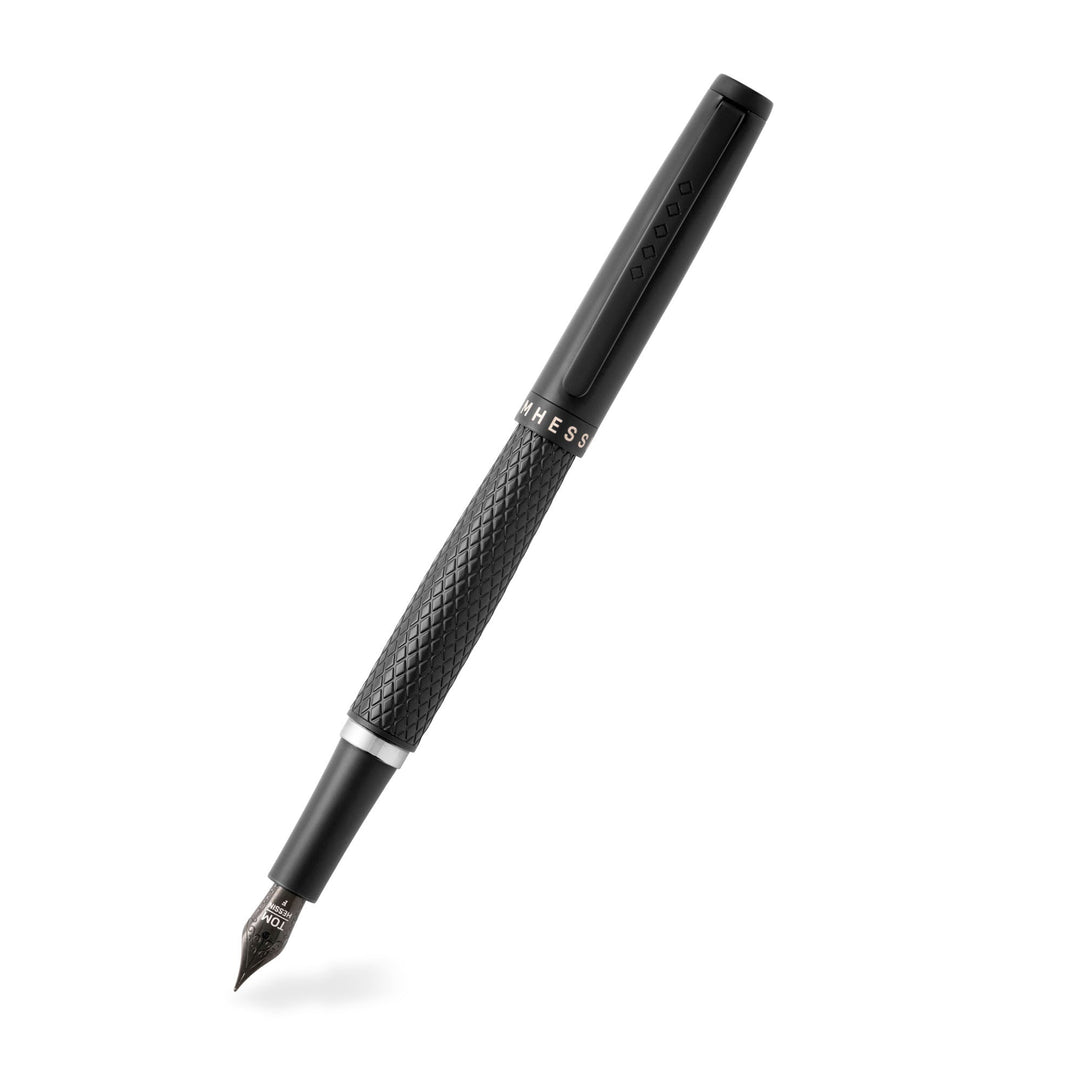Black fountain pen with diamond pattern barrel and showing the nib. 
