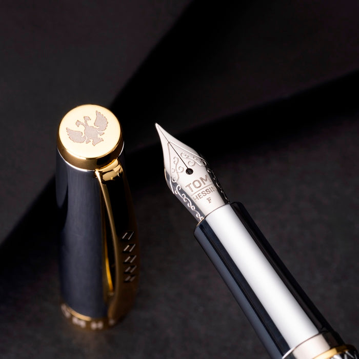 Close up of nib and top of cap. Nib is stamped with Tom Hessin. 