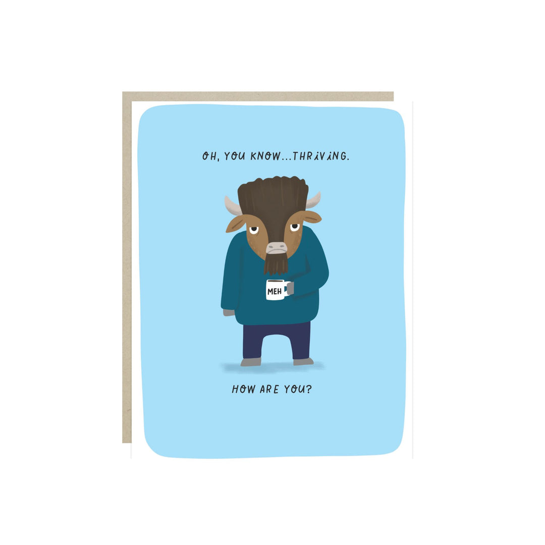 Front of card with an illustration of a buffalo wearing an turquoise jacket and black pants, and holding a coffee cup that says 'Meh,' on a blue background.  The text is "Oh, you know ... thriving. How are you?"