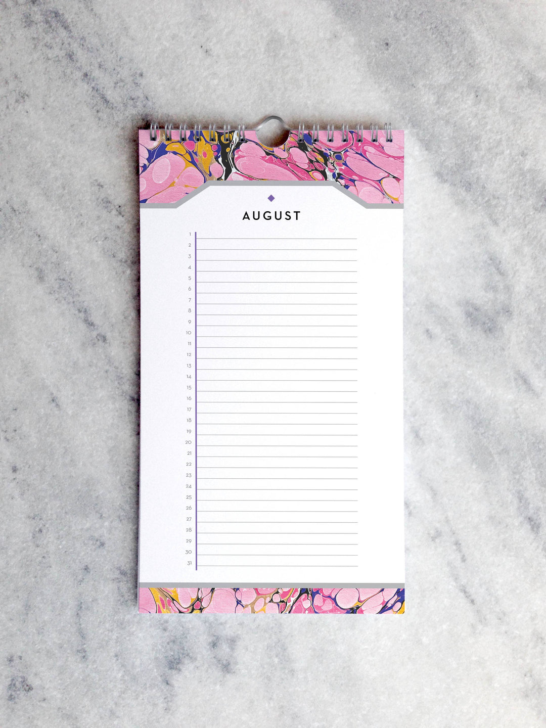 Page for January with marbled paper in shades of pink at the top and bottom. Below the month title is a line for each day of the month.