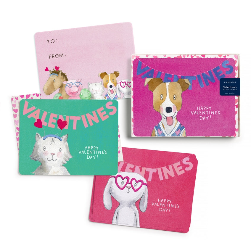 The three designs each showing a different cartoon dog under a Valentine's banner. The fourth card shows several dogs under space for To and From.