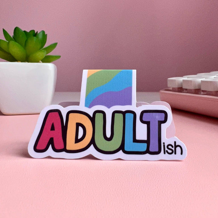 Each letter of the word "adult" is a different color, with "ish" in small letters after the T.