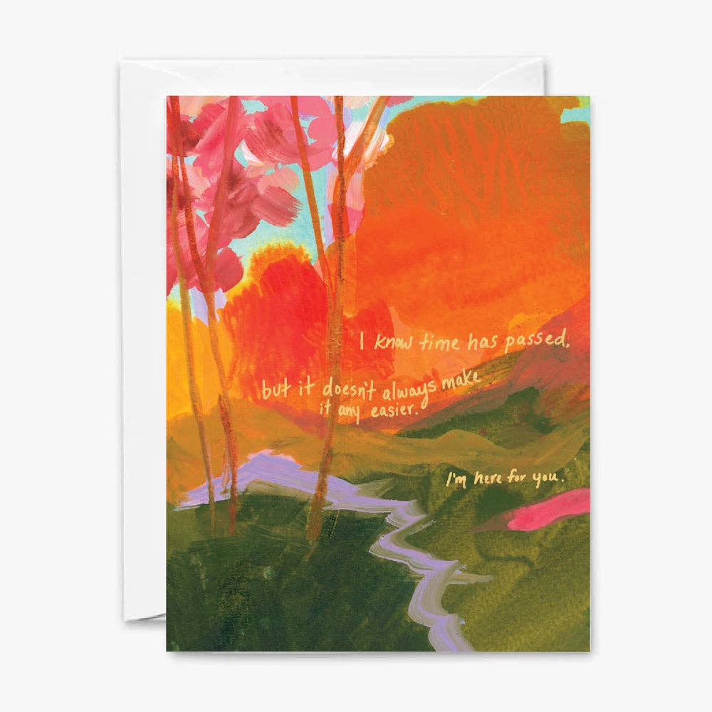 Front of sympathy card with abstract nature scene with green hills and a river with white text.