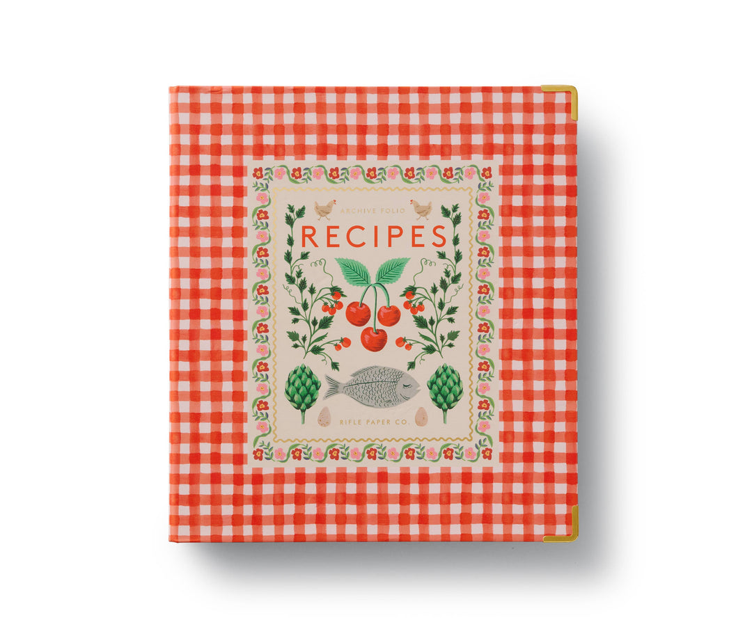Cover of the binder with reinforced metal corners, and an orange and white checkered pattern, featuring a title 'RECIPES' and decorated with illustrations of fruits, vegetables, and a fish. 