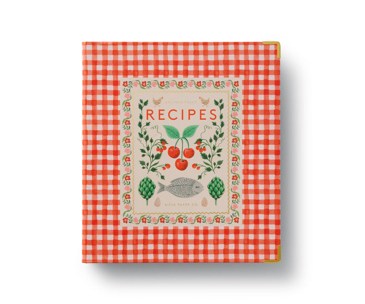Cover of the binder with reinforced metal corners, and an orange and white checkered pattern, featuring a title 'RECIPES' and decorated with illustrations of fruits, vegetables, and a fish. 