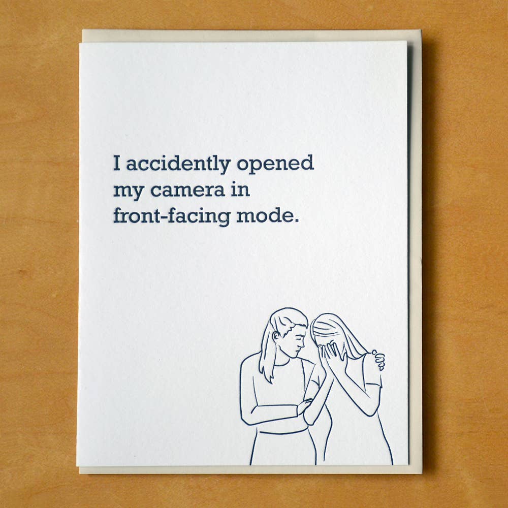 Front of card with a line drawing in black of one woman consoling another.