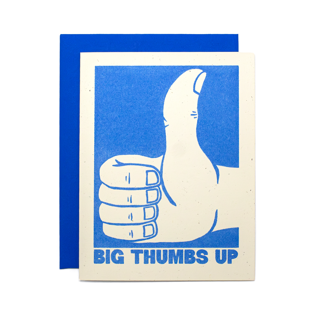 A greeting card with a blue and off-white graphic of a thumbs-up hand and the text 'BIG THUMBS UP', shown with a matching blue envelope behind it.