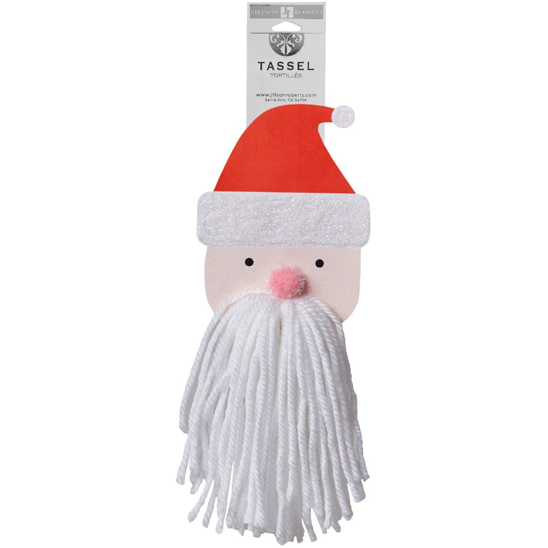 Santa head with beard of white yarn, wearing a red hat.