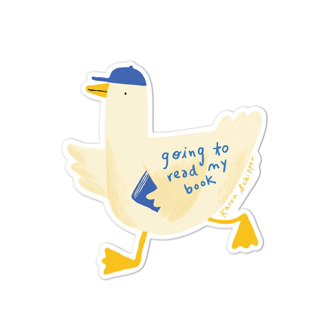 A die-cut sticker featuring a cartoon duck wearing a blue cap and holding a blue book, with the phrase 'going to read my book' written on its side. 